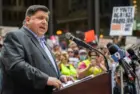 Protests in downtown Chicago after overturning of Roe v. Wade^ Governor of Illinois^ J. B. Pritzker^ talking to protester in support Chicago^ Illinois - June 24 2022