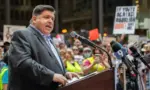 Protests in downtown Chicago after overturning of Roe v. Wade^ Governor of Illinois^ J. B. Pritzker^ talking to protester in support Chicago^ Illinois - June 24 2022