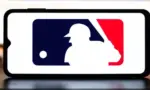Selective focus of the MLB logo. It is the premier professional baseball league in North America^ featuring top players and teams: