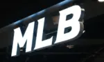 MLB (Major League Baseball) brand logo store sign close up