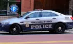Prince George's County^ Maryland police car sits parked on a street in National Harbor in front of a public parking garage.