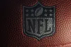 Closeup of an NFL logo on an American football