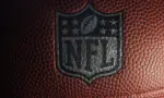 Closeup of an NFL logo on an American football