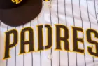 San Diego Padres baseball hat and team jersey.