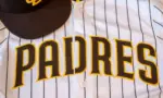 San Diego Padres baseball hat and team jersey.