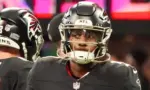 Atlanta Falcons quarterbacks Michael Penix Jr (9) before the game against the Carolina Panthers on January 5^ 2025 at Mercedes-Benz Stadium.