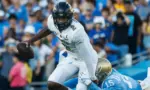 Colorado quarterback Shedeur Sanders #2 is tackled by UCLA defensive line Laiatu Latu #15 during an NCAA college football game between the UCLA and the Colorado^ Oct. 28^ 2023^ in Pasadena^ Calif.