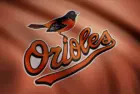 WAVING flag with Baltimore Orioles professional team logo. Close-up of waving flag with Baltimore Orioles MLB baseball team logo^ seamless loop.