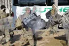 California National Guard troops prepare to board a bus for their return home after completing their assignment in Washington during the inauguration. Washington^ DC – January 22^ 2021