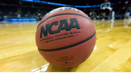 NCAA basketball/game ball sits on court