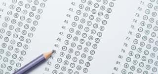 Standardized-test-form-with-answers-bubbled-in-and-a-pencil-picture-id591412546