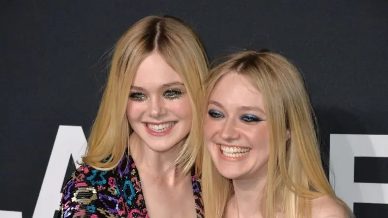 Elle Fanning & Dakota Fanning arriving at the Saint Laurent at the Palladium fashion show at the Hollywood Palladium. LOS ANGELES^ CA - FEBRUARY 10^ 2016