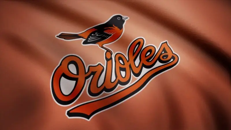 WAVING flag with Baltimore Orioles professional team logo. Close-up of waving flag with Baltimore Orioles MLB baseball team logo^ seamless loop.