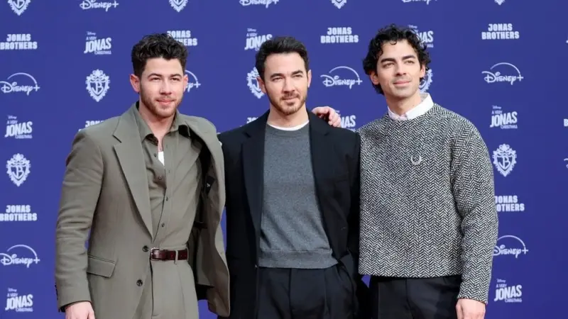 Nick Jonas^ Kevin Jonas^ Joe Jonas at Jonas Brothers Hand And Footprint In Cement Ceremony at the TCL Chinese Theater IMAX on December 3^ 2025 in Los Angeles^ CA