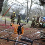 fire, Glasgow fire, Dorothy Wood, Dallas Wood, mobile home: Fire crews remove debris from a mobile home along Smiley Court after it caught fire early Wednesday, Jan. 19, 2022.