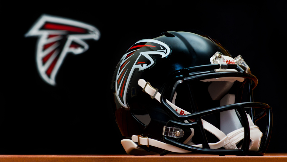 The Helmet Of The Atlanta Falcons Sits On A Wooden Board