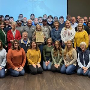 Farmers RECC employees accept their seventh Governor’s Safety and Health Award from KYSAFE Director Lynn Whitehouse at their recent all employee meeting.