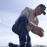 richard-guebert-jr-checking-soil-on-his-farm-150x150102801-1