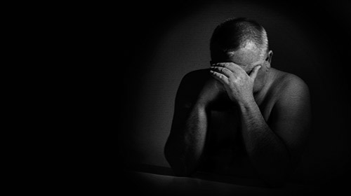 dramatic-black-and-white-close-up-portrait-of-aged-man-sitting-w-2