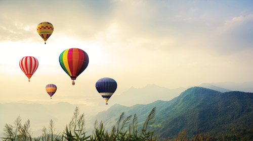 colorful-hot-air-balloons-flying-over-the-mountain-2