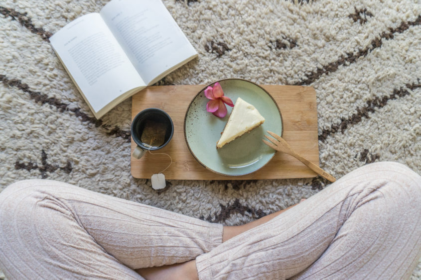 agirlenjoysarelaxingteaandcakewhilereading