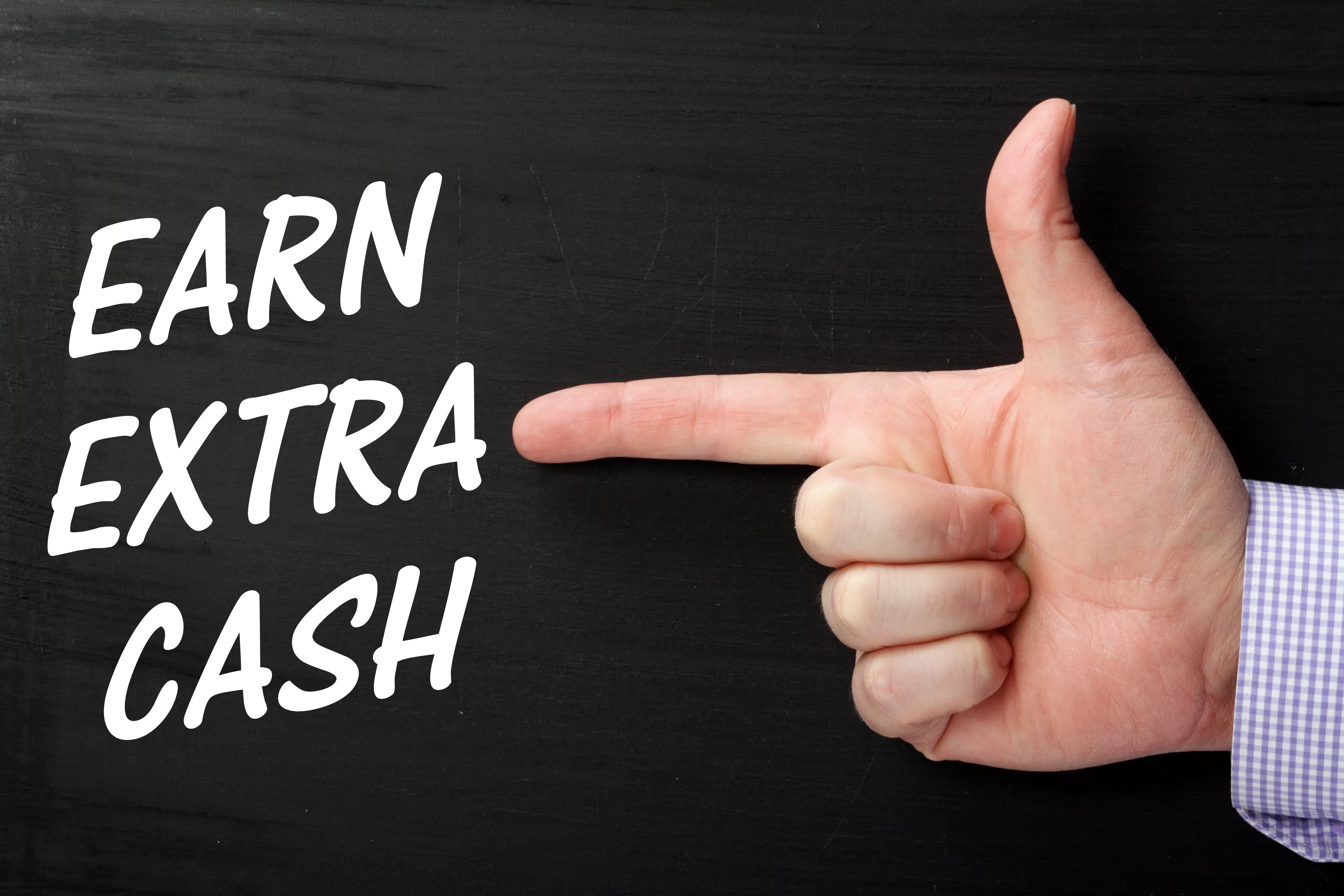 malehandpointingafingeratthephraseearnextra