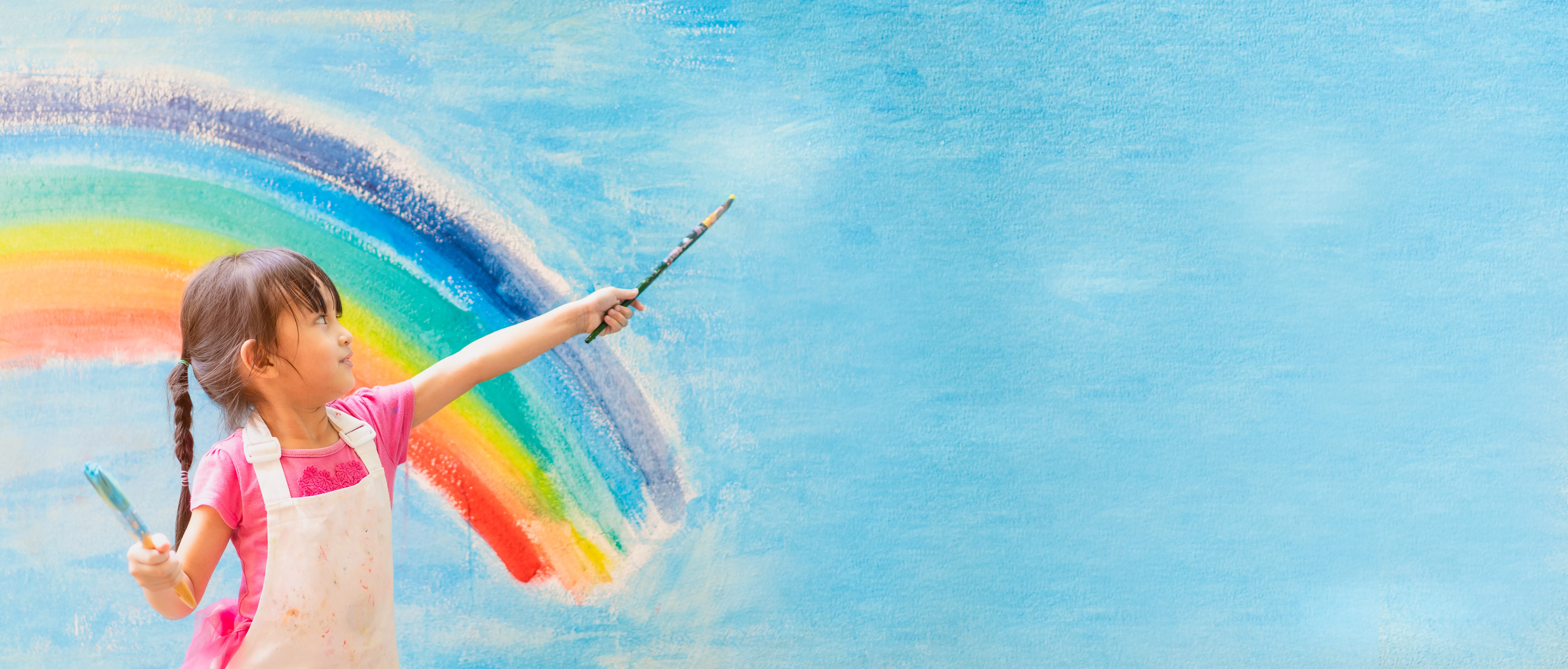 bannerofasianlittlegirlispaintingthecolorfulrainbow