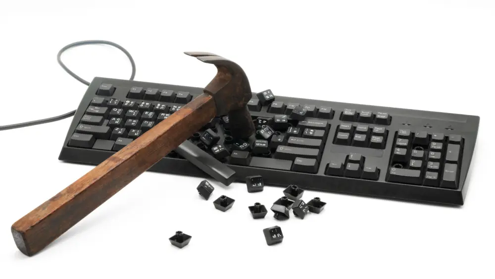 ahammerstrikesakeyboardshatteringkeysontothesurface