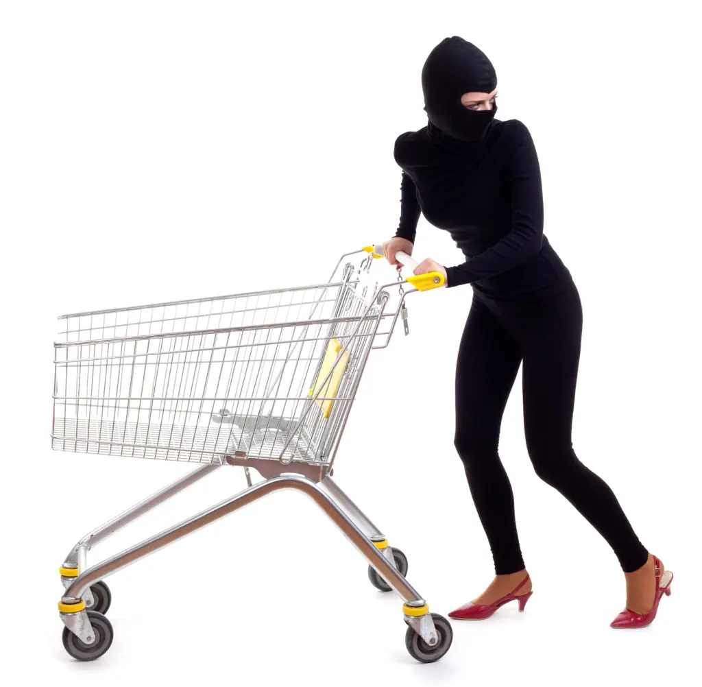 thiefinblackclothesandbalaclavawithshoppingcart