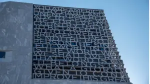 Chicago^ IL^ April 11^ 2026^ Barack Obama Presidential Center Tower with a blue sky background^ Presidential Library^ former President of the United States with words and letters on the exterior