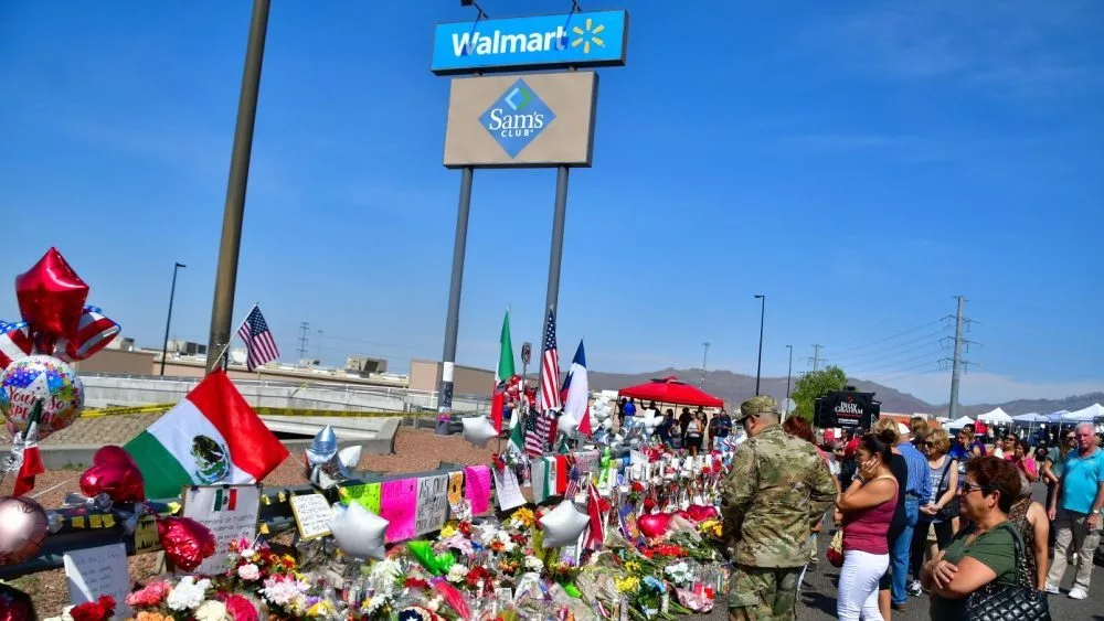 Flowers^ posters^ toys and other memorabilia left for the victims of the Walmart shooting on 3 August 2019. El Paso^ Texas / USA - August 2019