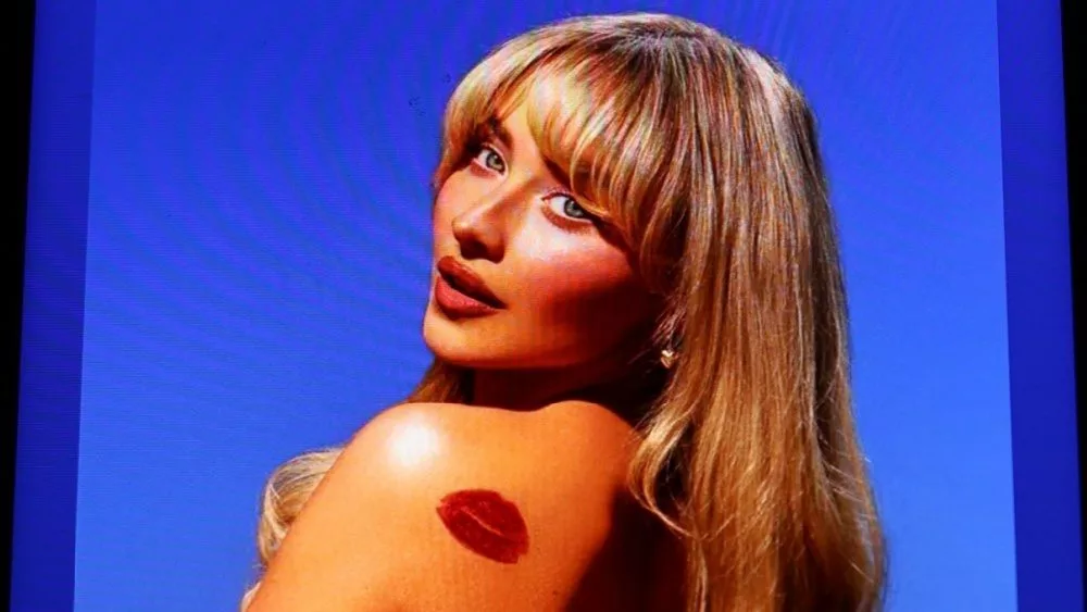 Sabrina Carpenter's Espresso streaming on Spotify from a phone on a black background