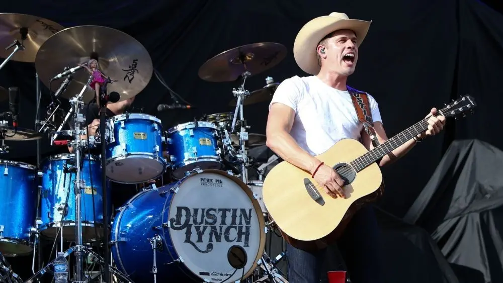 Dustin Lynch performs during the 'Kick The Dust Up' Tour at Vanderbilt Stadium on July 11^ 2015 in Nashville^ Tennessee.