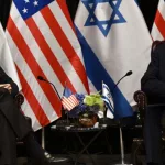 US President Joe Biden (L) listens to Israel's Prime Minister Benjamin Netanyahu as he joins a meeting of the Israeli war cabinet in Tel Aviv on October 18^ 2023