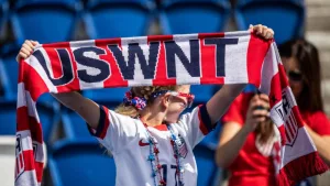 A fan holds USWNT scarf before the 2019 FIFA Women's World Cup match between USA and Chile.