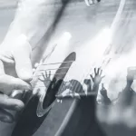 Guitarist with the audience in a double exposure.