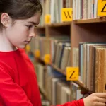 young-girl-in-library320563