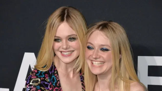Elle Fanning & Dakota Fanning arriving at the Saint Laurent at the Palladium fashion show at the Hollywood Palladium. LOS ANGELES^ CA - FEBRUARY 10^ 2016