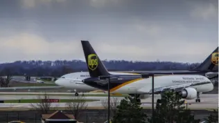 Louisville^ KY—March 6^ 2018 air cargo planes taxi to end of runway prior to take off