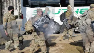 California National Guard troops prepare to board a bus for their return home after completing their assignment in Washington during the inauguration. Washington^ DC – January 22^ 2021