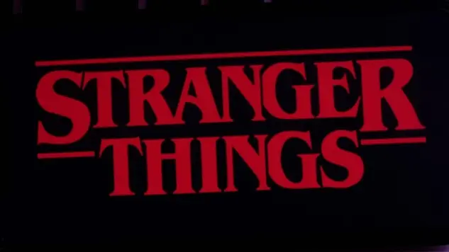 Iphone 11 pro with the Stranger Things logo on top of a computer keyboard. United States^ New York. Sunday^ September 29^ 2019.