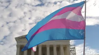 A transgender pride flag flies in front of the U.S. Supreme Court building in Washington^ DC.