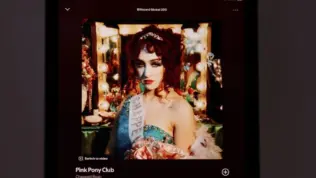 An Apple iPad displays the Spotify music streaming app. The screen the shows the song "Pink Pony Club" by "Chappell Roan" being played^ as well as the album cover art.