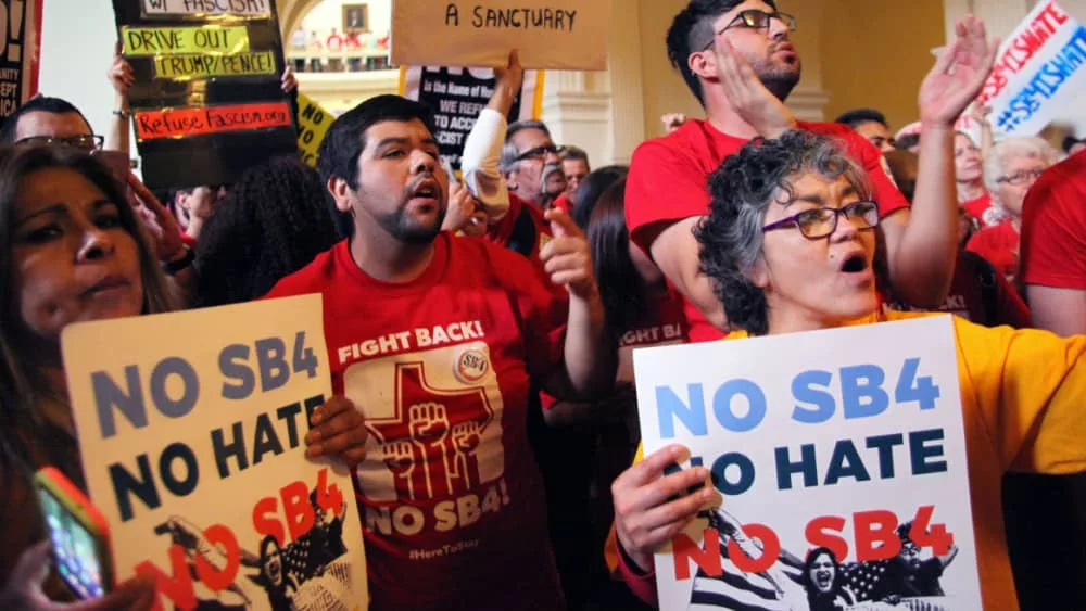 Demonstrators protest SB 4^ an anti-Sanctuary Cities immigration law^ under the dome of the state Capitol in Austin^ Texas^ USA - May 29^ 2017