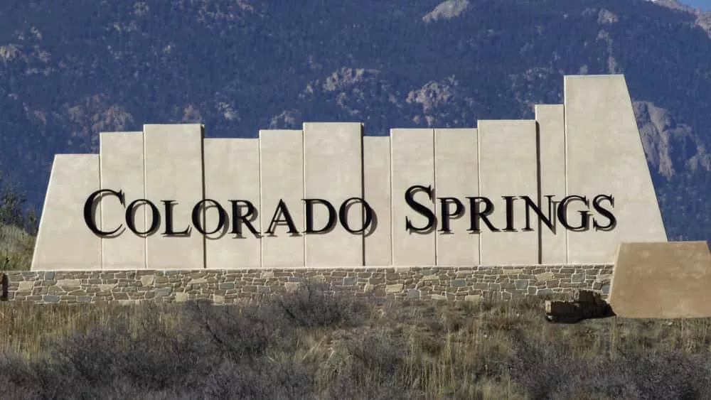 Colorado Springs city entry monument with Pikes Peak in the background. Colorado Springs^ CO