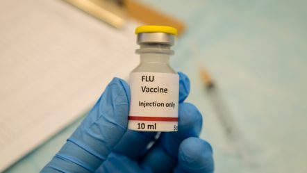 flu-control-by-flu-vaccine-holding-in-hand-8zj7hb9