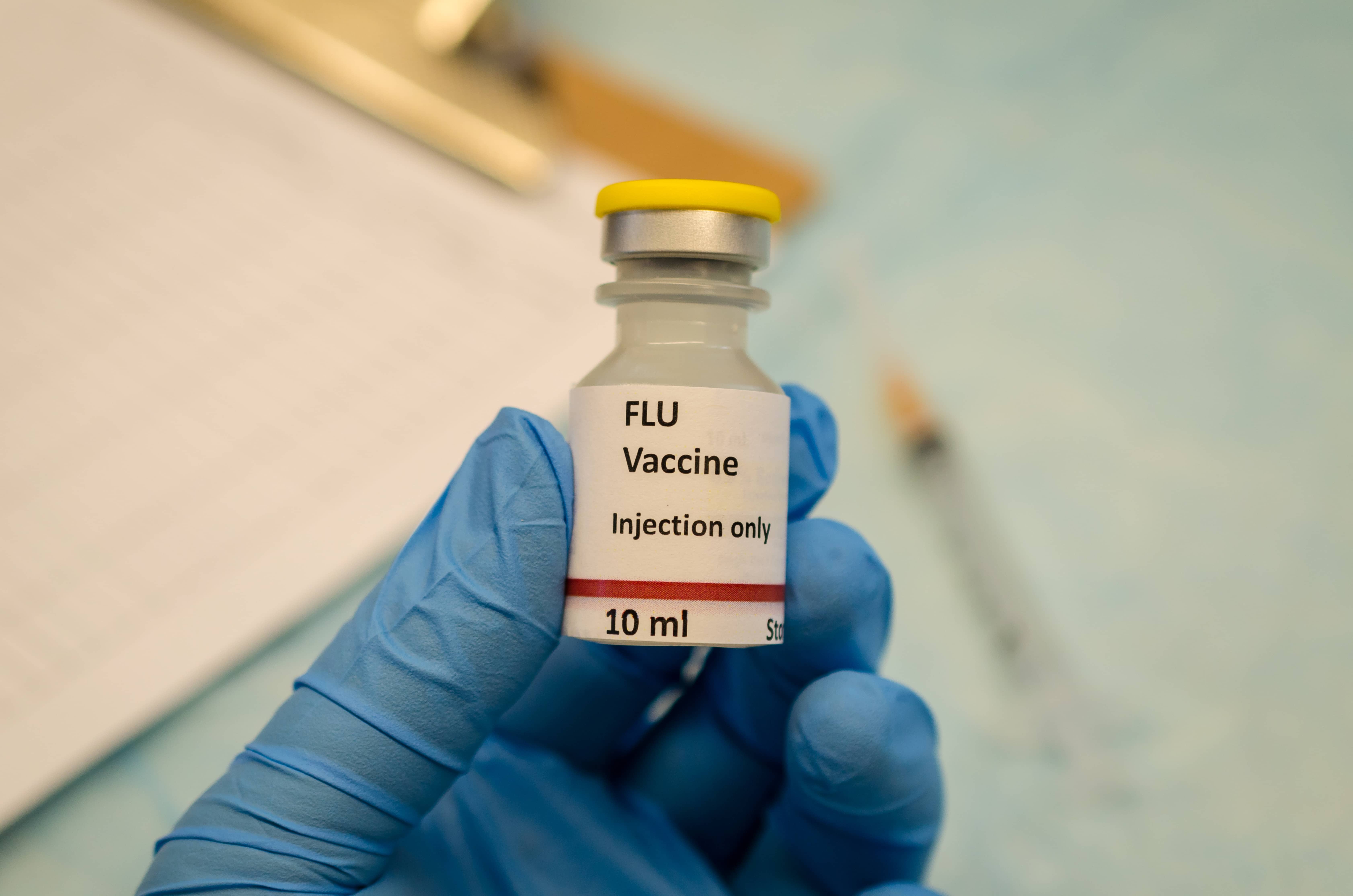 flu-control-by-flu-vaccine-holding-in-hand-8zj7hb9