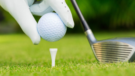 close-up-view-of-golf-ball-on-tee-on-golf-course