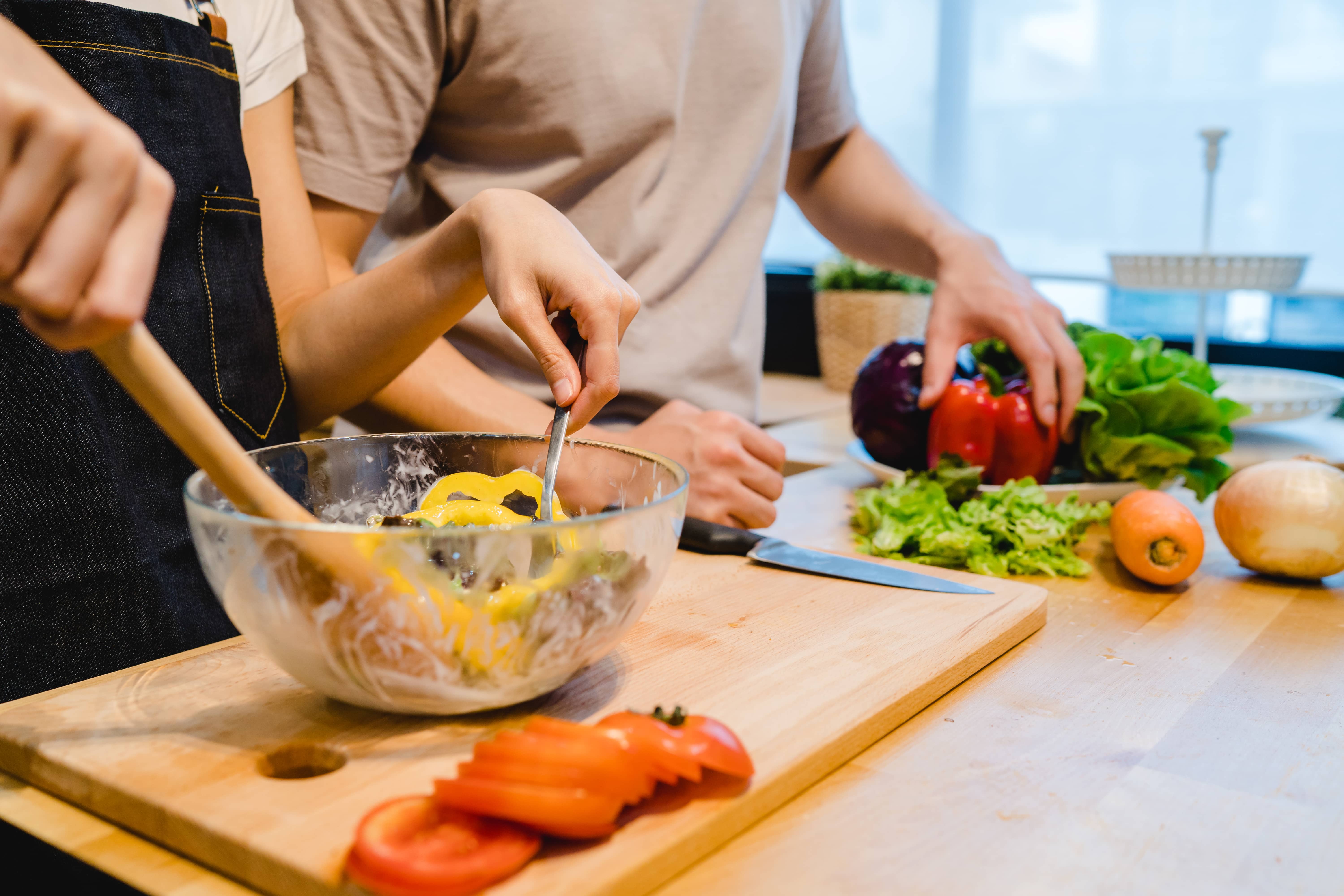 asian-woman-prepare-salad-food-in-the-kitchen-beautiful-happy-a