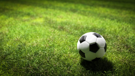 football-soccer-ball-on-grass-field